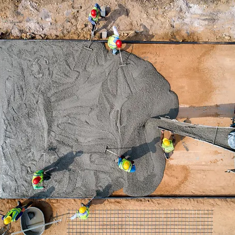 men pouring concrete
